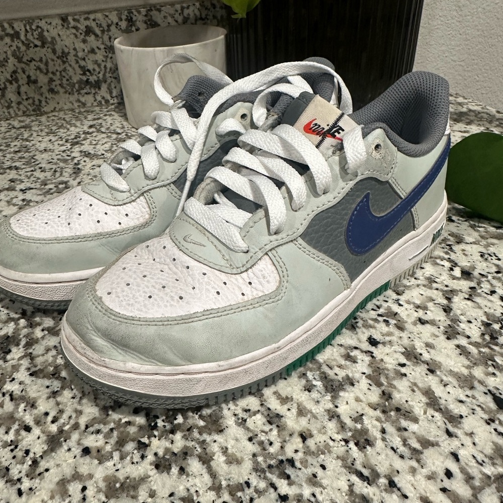 Nike White and Gray Sneakers with Blue Swoosh
